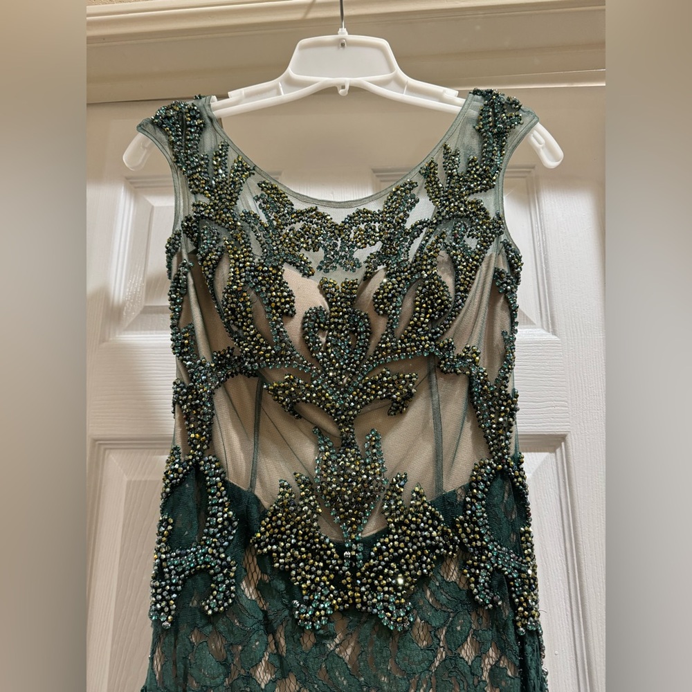 Gorgeous green open back lace evening gown with nude underlay
